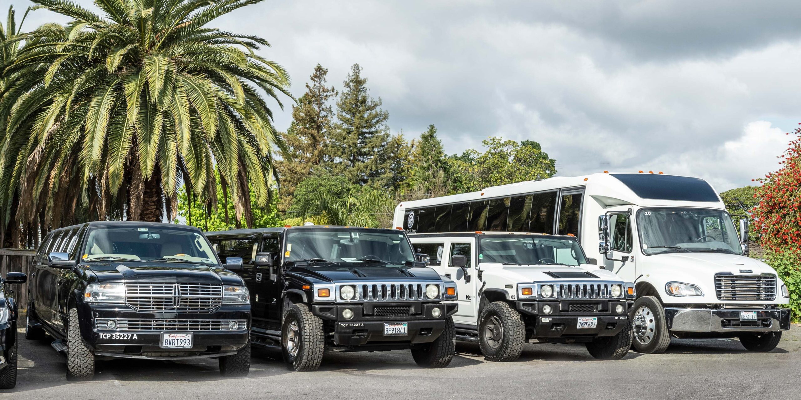 Contact Us - Code 3 Transportation - Photo: luxury vehicles parked in a row.